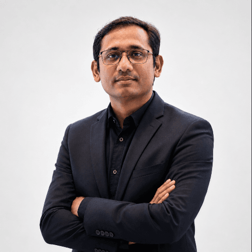 Professional portrait of Uachash Barua in a dark blazer